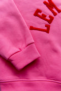 Winter: sweater roze met rode letters